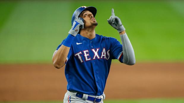 Sep 6, 2020; Seattle, Washington, USA; Texas Rangers first baseman Ronald Guzman (11) celebrates after hitting a solo-home run against the Seattle Mariners during the ninth inning at T-Mobile Park. Mandatory Credit: Joe Nicholson-USA TODAY Sports